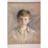 In the manner of HAROLD RILEY (b.1934), pastel of a young boy, 44 x 53 cm, mounted and framed,