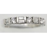 Silver fancy cubic zirconia half eternity ring. P&P Group 1 (£14+VAT for the first lot and £1+VAT