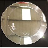 Large flower shaped bevel edge mirror with twelve petal panels, D: 70 cm. This lot is not