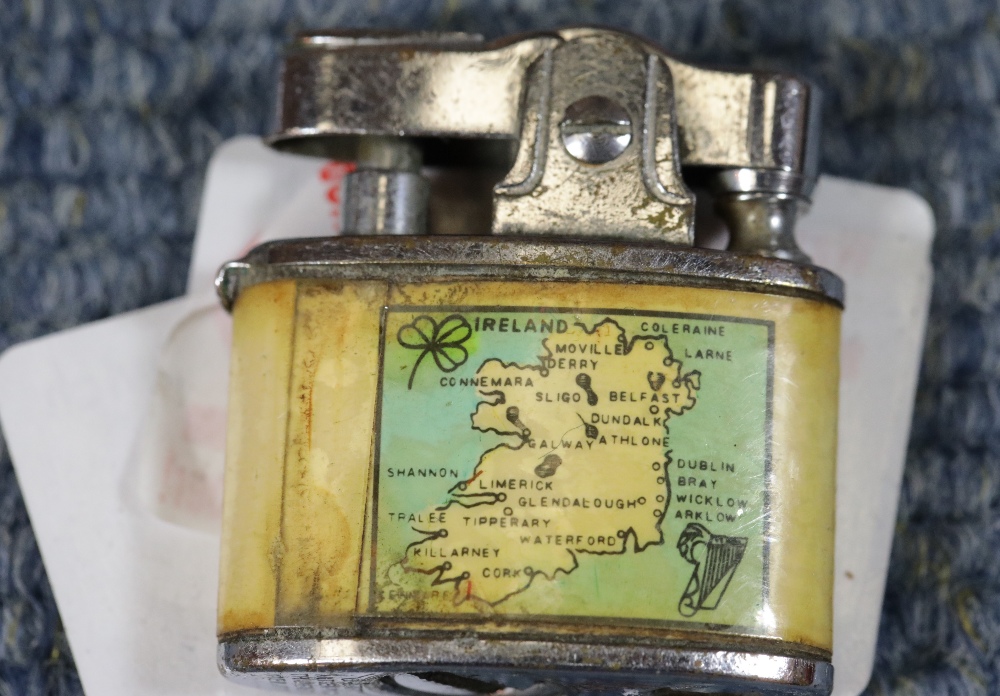 Vintage Ireland souvenir miniature mechanical lighter. No wick or flint but movement works. P&P