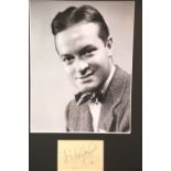 Bob Hope, framed signature with publicity shot photograph, 24 x 19 cm, with no CoA. P&P Group 2 (£