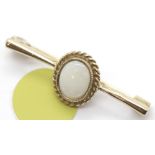 Ladies 9ct gold opal fancy brooch, 2.0g. P&P Group 1 (£14+VAT for the first lot and £1+VAT for