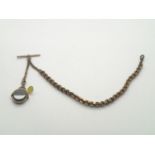 Heavy yellow metal watch chain, T-bar and spinning fob with blood stone and carnelian panels,