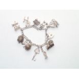 Vintage Silver Charm Bracelet with 11 charms 39g P&P group 1 (£16 for the first item and £1.50 for
