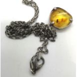 Sterling silver pendant necklace with an amber piece containing an insect