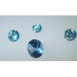 Loose gemstones: Four graduated blue topaz stones, largest weighing 3.05cts, D: 9mm Please note