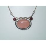 Contemporary sterling silver necklace with a large oval rose quartz pendant L: 42 cm P&P group 1 (£