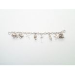 Vintage silver charm bracelet with 8 charms 28g P&P group 1 (£16 for the first item and £1.50 for