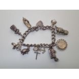 Vintage Charm Bracelet with 9 charms 65g P&P group 1 (£16 for the first item and £1.50 for