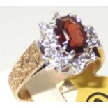 18ct gold garnet and diamond set ring size M/N 4.6g P&P group 1 (£16 for the first item and £1.50