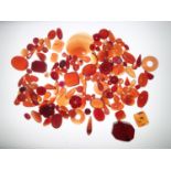 Loose gemstones: red and banded agate and carnelian, largest stone weighing 94.6cts, 28.6mm x 24mm