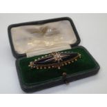 Boxed Georgian / Victorian presumed gold mourning brooch, enamelled with oval glazed panel to the