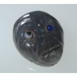 Loose gemstones: A carved and polished possibly opal monkey's head with coloured eyes, 9.3ctssize 15
