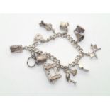 Vintage silver charm bracelet with 10 charms, 52g P&P group 1 (£16 for the first item and £1.50