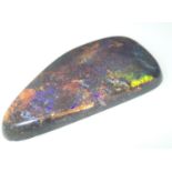 Loose gemstones: A large polished black opal weighing 62cts, 50mm x 26mm Please note gemstones