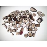 Loose gemstones: large amount of smokey quartz and similar coloured stones, largest stone weighing