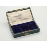 An Edwardian leather bound and velvet fitted gentleman's travelling jewellery case, spaces for