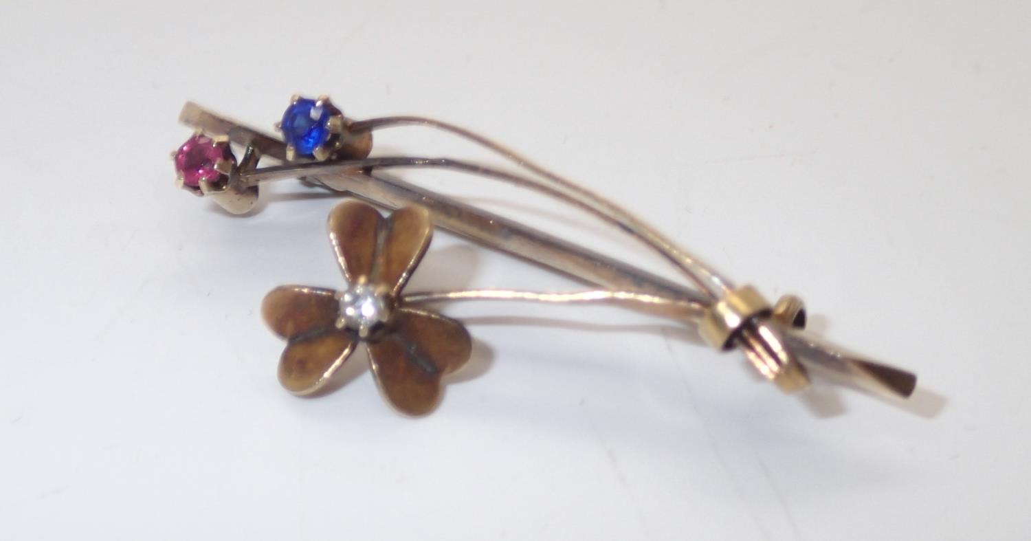 15ct flower head brooch set with diamond, sapphire and ruby, 3.8g P&P group 1 (£16 for the first