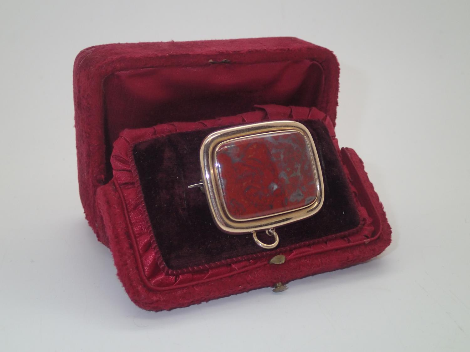 A boxed large Victorian mourning brooch, rectangular form having a large panel of agate, and