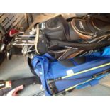 Two golf bags with a mixture of golf clubs by Cobra, Fazer etc. This lot is not available for in-