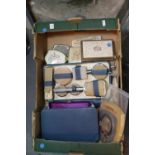 Box containing ladies vanity sets and a dressing table set. P&P Group 1 (£14+VAT for the first lot