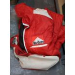 Holdall of motor sport clothing. P&P Group 1 (£14+VAT for the first lot and £1+VAT for subsequent