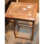 Wooden side table with carved detail and Oriental writing to the underside. This lot is not