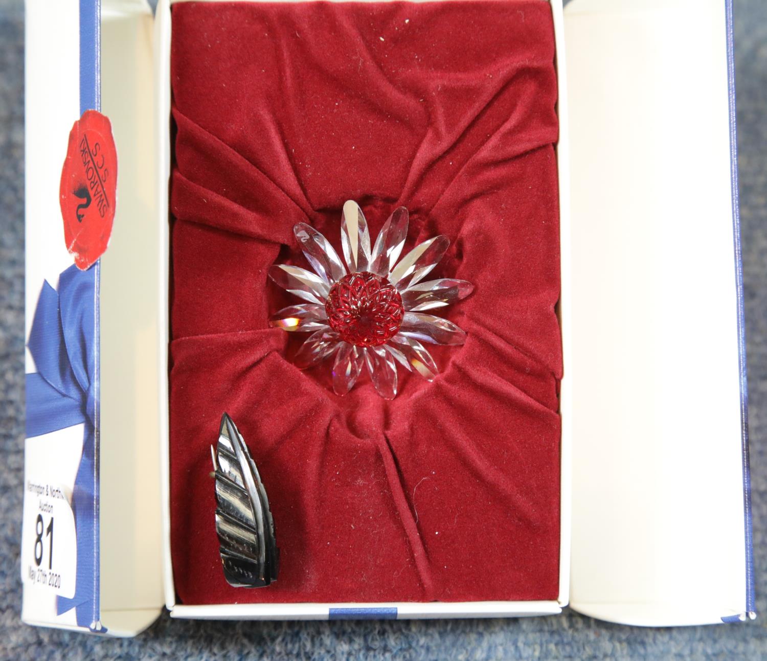 Swarovski boxed brooch and a jet brooch. P&P Group 1 (£14+VAT for the first lot and £1+VAT for