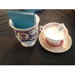 Buckingham Palace cup and saucer and a Coalport limited edition Charles and Diana goblet with