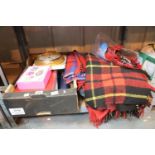 Shelf of mixed items including woollen blankets and household equipment.This lot is not available