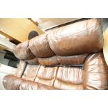 Large brown leather three piece settee. This lot is not available for in-house P&P, please contact