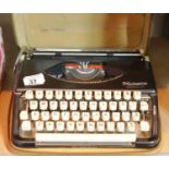 Olympia portable cased typewriter. P&P Group 2 (£18+VAT for the first lot and £2+VAT for