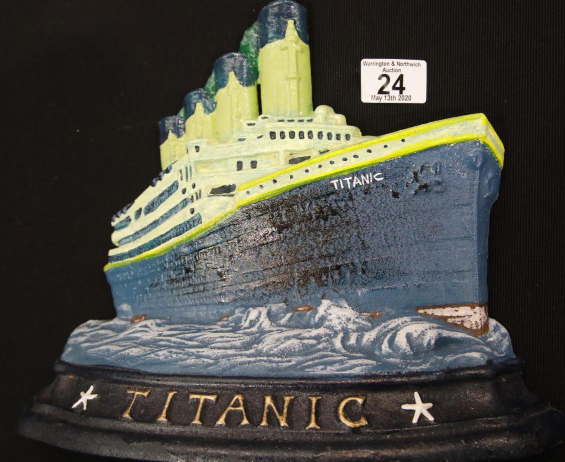 Large cast iron Titanic doorstop H: 26 cm. P&P Group 2 (£18+VAT for the first lot and £2+VAT for