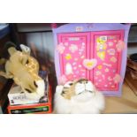 Doll wardrobe with contents, collection of board games and two plush animal heads.This lot is not