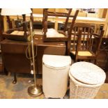 An oak dropleaf table and four chairs, two linen baskets and a lamp. This lot is not available for