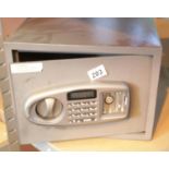 Small metal safe with key. This lot is not available for in-house P&P, please contact the office for