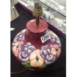 Moorcroft bulbous Pansy lamp with dark pink ground