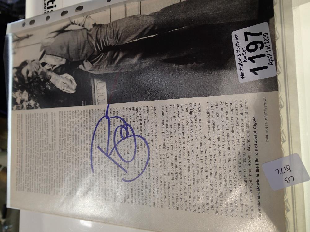 Signed David Bowie magazine page with COA from Super-Star-Autographs