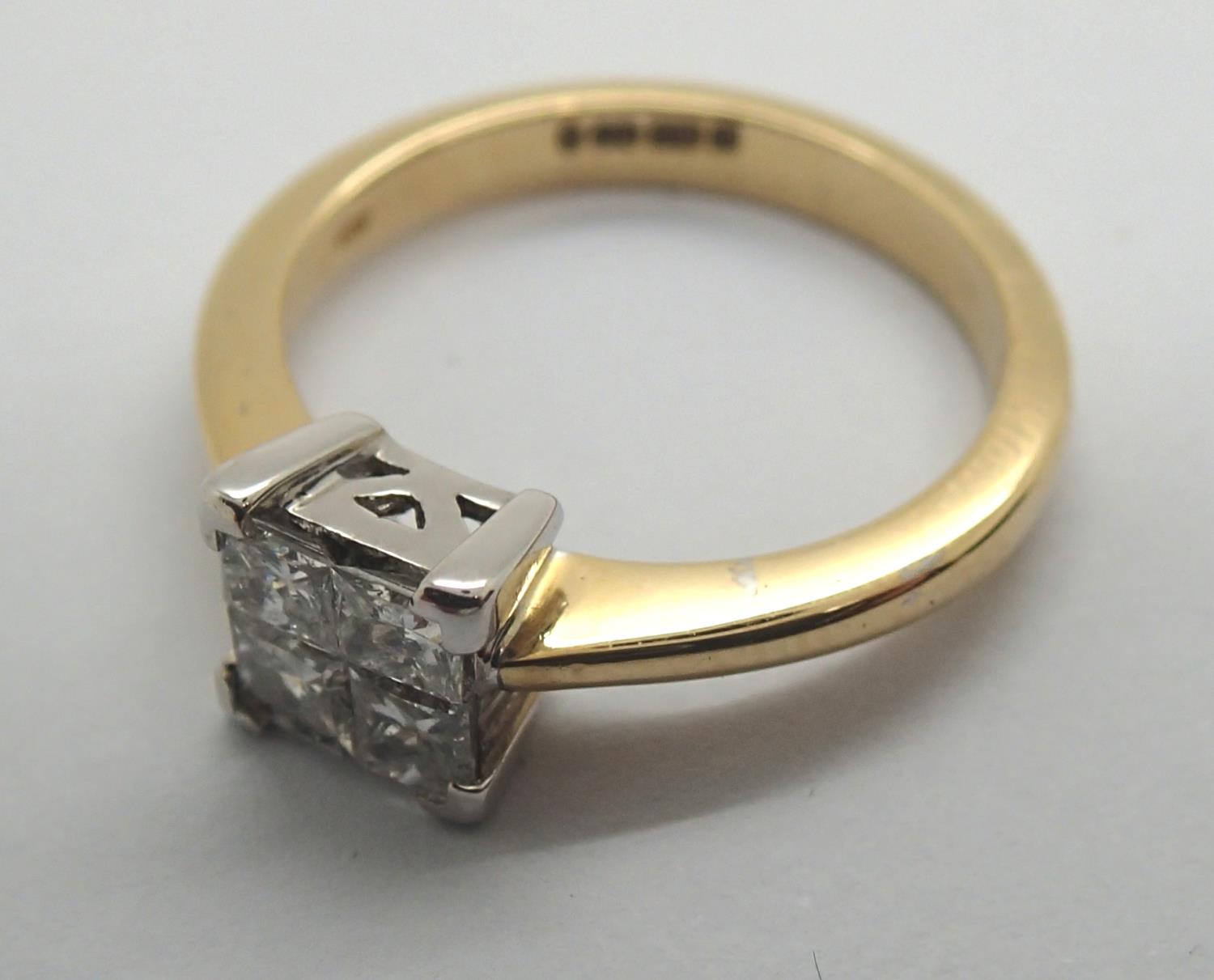 An 18ct gold and diamond engagement ring of 0.5cts. 4g, size L1/2