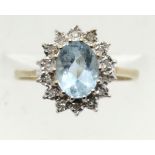 9ct gold blue topaz and diamond cluster ring, size K, 2.0g. P&P Group 1 (£14+VAT for the first lot