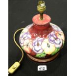 Moorcroft bulbous Pansy lamp with dark pink ground. P&P Group 1 (£14+VAT for the first lot and £1+