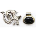 Silver and onyx oval pendant and a presumed silver dragon pendant. P&P Group 1 (£14+VAT for the