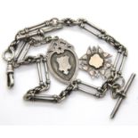 Victorian hallmarked silver double Albert watch chain of twisted trombone links, having two silver