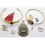 Assorted costume jewellery including two bangles and nine pendants. P&P Group 1 (£14+VAT for the