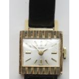 Ladies Rolex Tudor 1960s 18ct gold cased wristwatch with square silver dial on a black leather strap