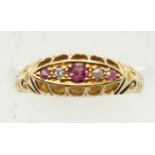 Victorian 18ct gold three stone ruby and diamond ring, size O, 2.0g. P&P Group 1 (£14+VAT for the
