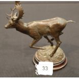 Geoffrey Dashwood bronze model of running stag on circular domed naturalistic base signed Dashwood