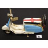Tinplate blue and white model scooter. P&P Group 2 (£18+VAT for the first lot and £2+VAT for