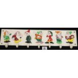 Cast iron Seven Dwarves hanging hook rack L: 58 cm. P&P Group 2 (£18+VAT for the first lot and £2+