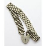 Vintage silver heavy link bracelet with padlock clasp. P&P Group 1 (£14+VAT for the first lot and £